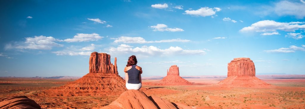 A woman practicing mindfulness in a desert