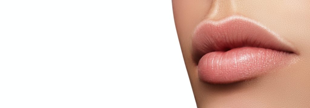 A close-up of swollen lips after getting Lip Fillers